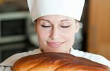Radiant female chef baking bread 