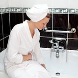 Attractive young woman preparing her bubble bath