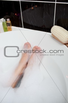 Feet in a bubble bath 