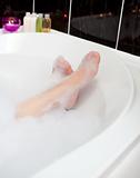 Woman's feet in a bubble bath 