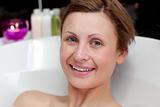 Close-up of a smiling woman having a bath