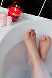 Close-up of woman's feet in a bath
