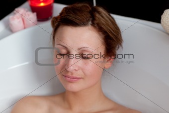 Beautiful woman relaxing in a bath