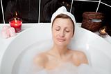 Beautiful woman relaxing in a bubble bath 
