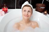 Radiant woman relaxing in a bubble bath 