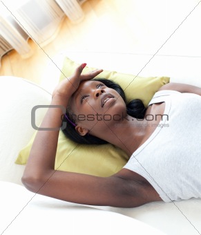 Portrait of a sick woman lying on a sofa 