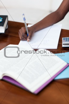 Portrait of a cheerful teen girl studying