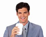 Enthusiastic businessman drinking a coffee 