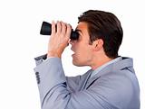 Surprised businessman looking through binoculars against a white background