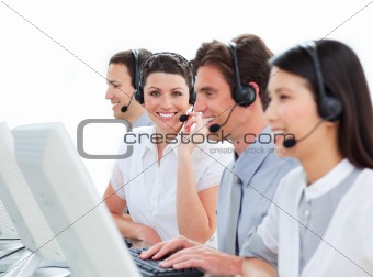 Cheerful business people talking on headset
