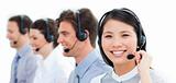 Portrait of smiling customer service agents working in a call ce
