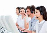 Portrait of enthusiastic customer service agents working in a ca