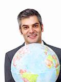 Charisatic businessman holding a terrestrial globe 