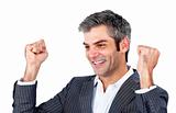 Cheerful businessman punching the air in celebration 