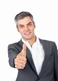 Mature businessman with thumb up 