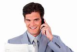 Assertive businessman on phone holding a newspaper 