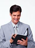 Smiling businessman holding an agenda 