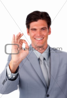 Cheerful businessman showing OK sign 