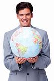 Charismatic businessman holding a terrestrial globe 