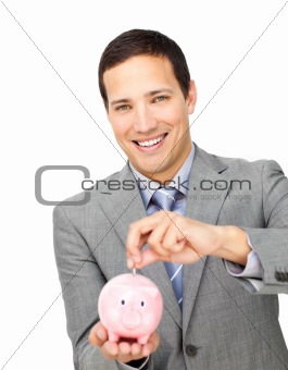 Self-assured businessman saving money in a piggy-bank