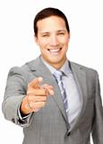 Smiling businessman pointing at the camera 