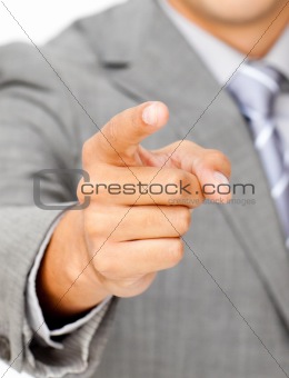 Close-up of a businessman pointing at the camera 