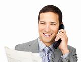 Positive businessman on phone holding a newspaper 