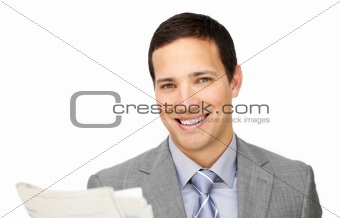 Assertive businessman reading a newspaper 