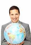 Attractive businessman holding a terrestrial globe 