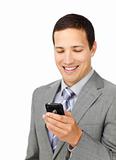 Smiling male executive using a mobile phone 