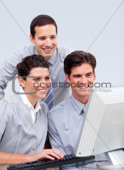 Lucky businessteam working at a computer