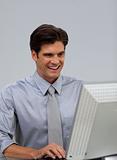 Confident businessman working at a computer 