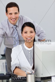 Attractive businesswoman helping by her manager