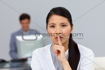 Serious businesswoman asking for silence