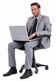 Business man sitting with laptop and smiling