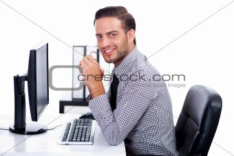 Business man smiling at you in the office
