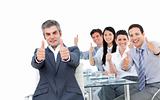 Successful business people with thumbs up 