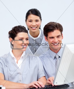 Ambitious business people working at a computer