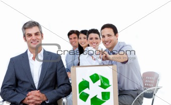 Confident business people showing the concept of recycling 