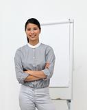Self-assured asian businesswoman with folded arms 