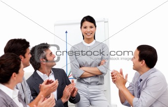 Successful businesswoman applauded for her presentation