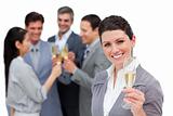 Fortunate business team toasting with Champagne