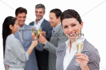 Fortunate business team toasting with Champagne