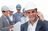 Smiling male architect on phone standing