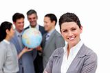 Successful business team holding a terrestrial globe