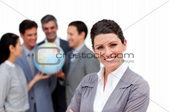 Successful business team holding a terrestrial globe