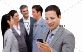 Assertive manager on phone standig in front of his team 
