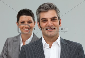 Smiling business associates in a row 