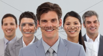 Smiling business people showing diversity 