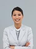 Smiling businesswoman with folded arms 